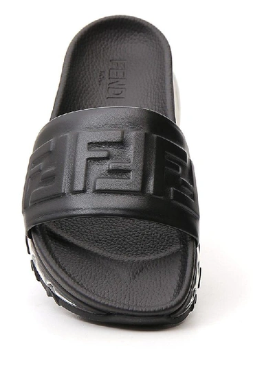 Shop Fendi Ff Monogram Embossed Slides In Black