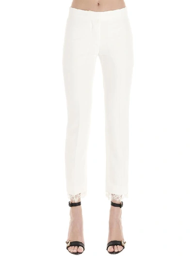 Shop Alexander Mcqueen Lace Hem Pants In White