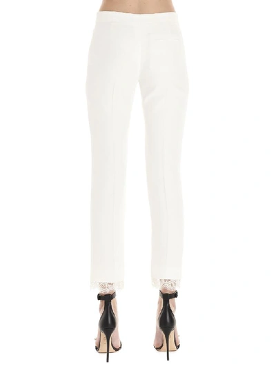 Shop Alexander Mcqueen Lace Hem Pants In White