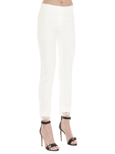 Shop Alexander Mcqueen Lace Hem Pants In White