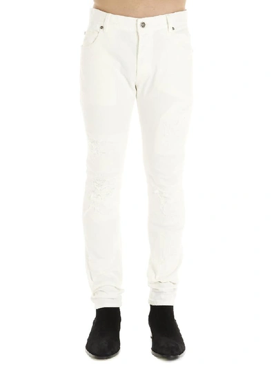 Shop Balmain Distressed Jeans In White