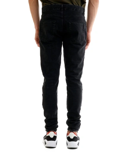 Shop Saint Laurent Skinny Jeans In Black