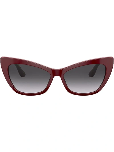 Shop Dolce & Gabbana Cat Eye Frame Sunglasses In Red