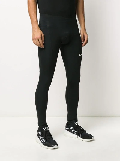 Shop Nike Logo-print Compression Tights In Black