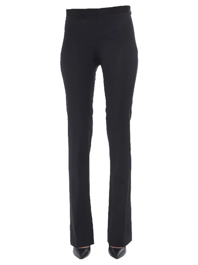 Shop Versace Flared Trousers In Nero