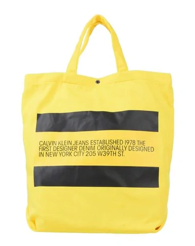 Shop Calvin Klein Jeans Est.1978 Handbags In Yellow