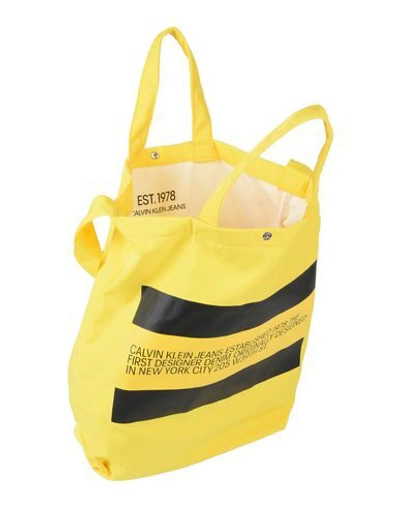 Shop Calvin Klein Jeans Est.1978 Handbags In Yellow