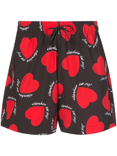 Shop Amiri Drawstring Heart Print Swim Shorts In 红色