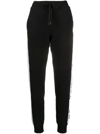 Shop Dkny Logo-flip Slim-fit Track Pants In Black