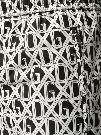 Shop Dolce & Gabbana Repeat Logo Trousers In Black