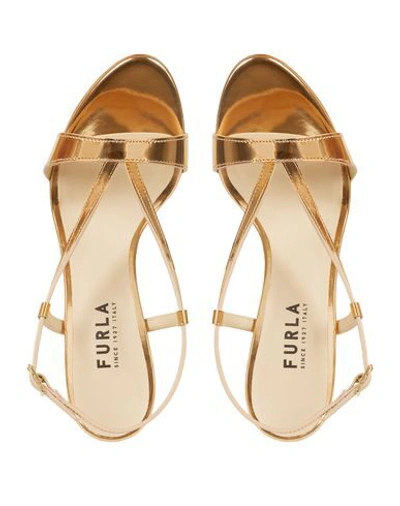 Shop Furla Sandals In Gold