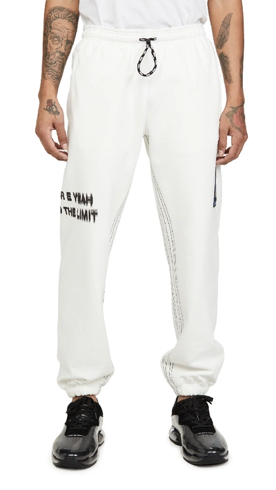 Shop Adidas Originals By Alexander Wang Graphic Joggers In Core White