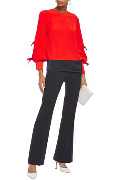 Shop Victoria Victoria Beckham Satin-paneled Bow-embellished Crepe Blouse In Tomato Red