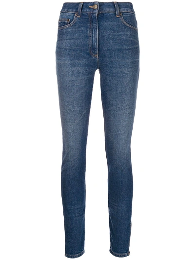 Shop Moschino Faded Skinny Jeans In Blue