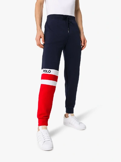 Shop Polo Ralph Lauren Striped Logo Track Pants In Blue