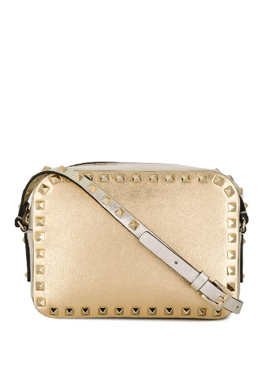 Shop Valentino Rockstud Crossbody Bag In Gold