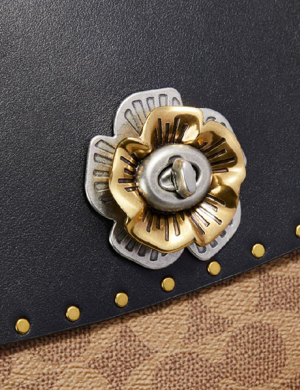 coach parker with rivets and snakeskin detail