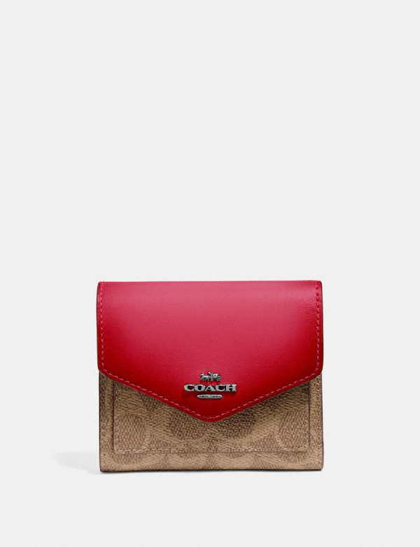 red and tan coach purse