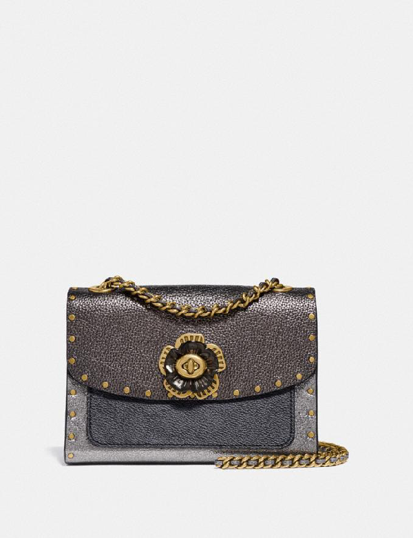 parker in signature canvas with rivets and snakeskin detail