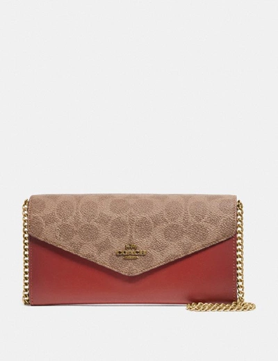 Shop Coach Envelope Chain Wallet In Colorblock Signature Canvas In Tan/rust/brass