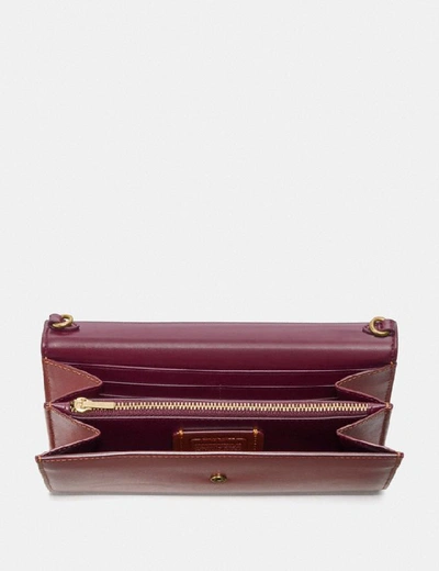 Shop Coach Envelope Chain Wallet In Colorblock Signature Canvas In Tan/rust/brass