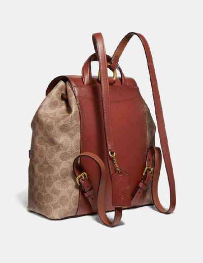 Shop Coach Evie Backpack In Signature Canvas In Tan/rust/brass