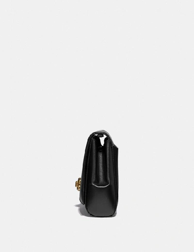 Shop Coach Alexa Turnlock Clutch In Black/brass