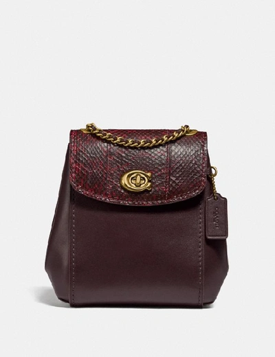 Shop Coach Parker Convertible Backpack 16 With Snakeskin Detail In Brass/deep Red