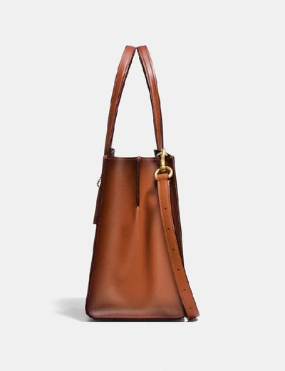 Shop Coach Charlie Carryall In Signature Canvas In Rust/brass