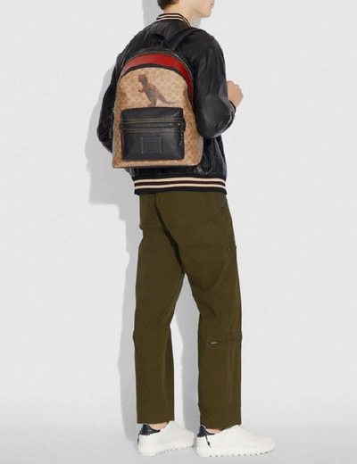 Shop Coach Academy Backpack In Signature Canvas With Rexy By Sui Jianguo - Men's In Khaki/black Copper