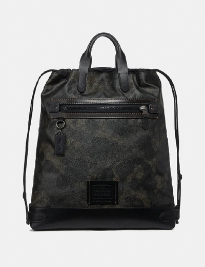 Shop Coach Academy Drawstring Backpack In Signature Canvas With Wild Beast Print In Green Wild Beast Signature/black Copper