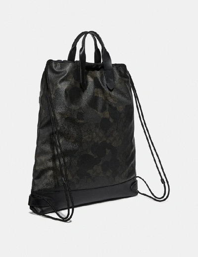 Shop Coach Academy Drawstring Backpack In Signature Canvas With Wild Beast Print In Green Wild Beast Signature/black Copper