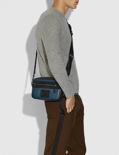 Shop Coach Academy Crossbody With Signature Canvas Blocking In Color<lsn_delimiter>black Copper/midnight Navy/charcoal