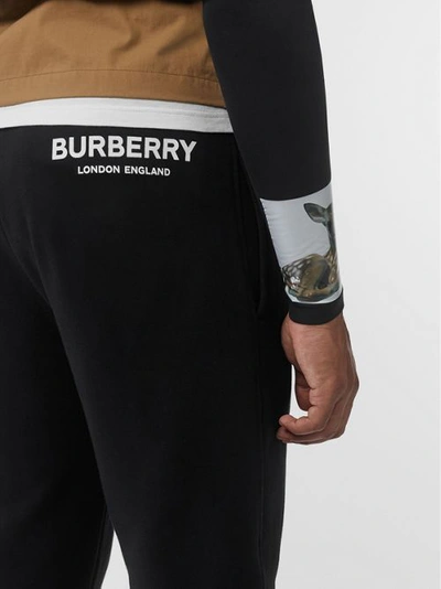 Shop Burberry Logo Print Cotton Trackpants In Black