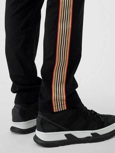 Shop Burberry Slim Fit Icon Stripe Detail Cotton Chinos In Black