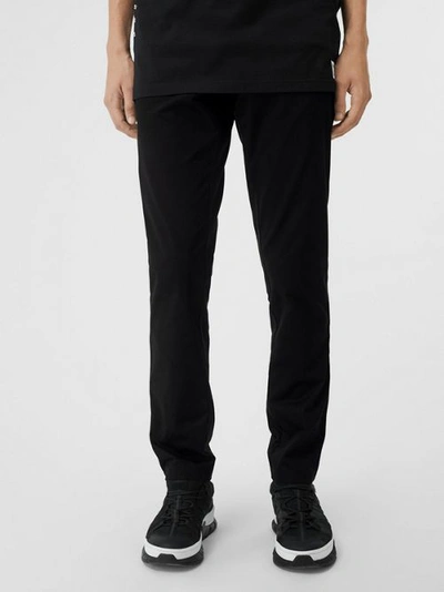 Shop Burberry Slim Fit Icon Stripe Detail Cotton Chinos In Black