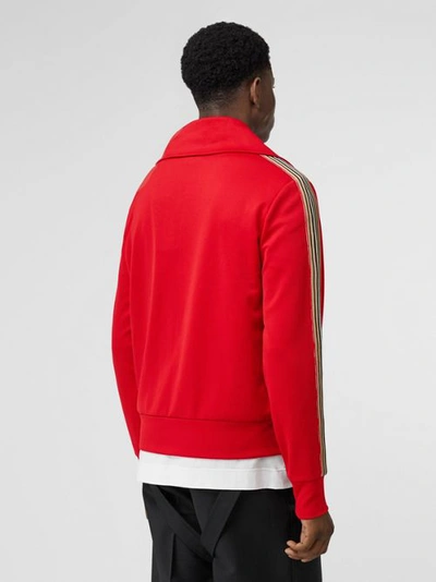 Shop Burberry Icon Stripe Detail Funnel Neck Track Top In Bright Red