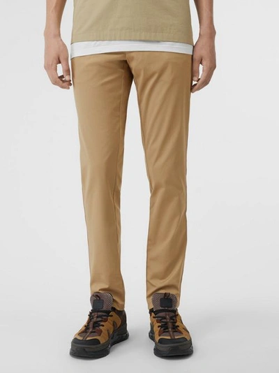 Shop Burberry Slim Fit Icon Stripe Detail Cotton Chinos In Honey