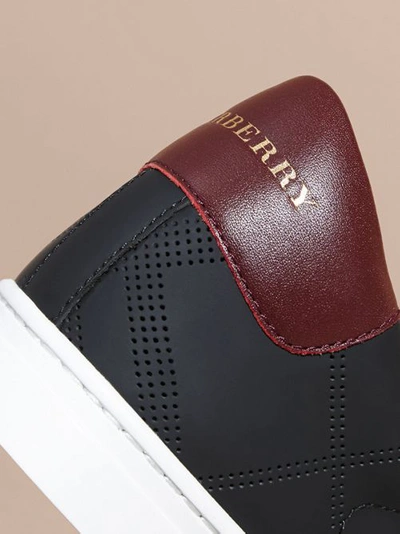 Shop Burberry Perforated Check Leather Trainers In Black/deep Claret Melange