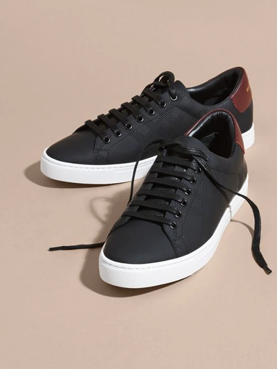 Shop Burberry Perforated Check Leather Trainers In Black/deep Claret Melange