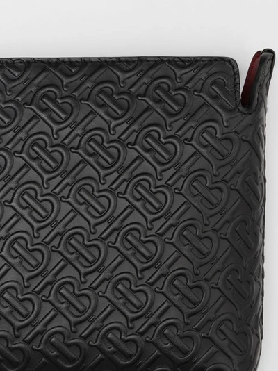Shop Burberry Medium Monogram Leather Clutch In Black