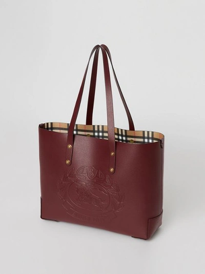 Shop Burberry Small Embossed Crest Leather Tote In Burgundy