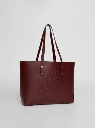 Shop Burberry Small Embossed Crest Leather Tote In Burgundy