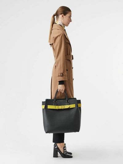 Shop Burberry The Large Leather Belt Bag In Black/yellow