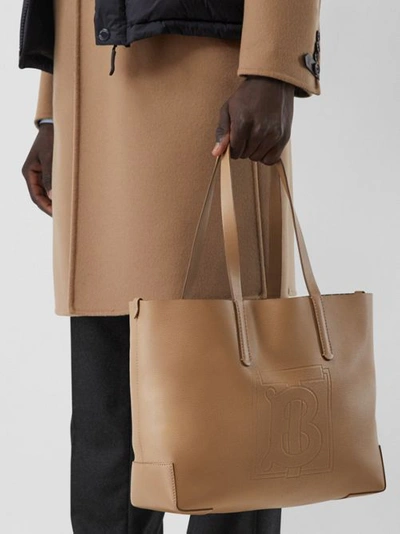 Shop Burberry Embossed Monogram Motif Leather Tote In Camel