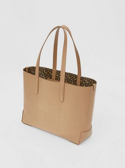 Shop Burberry Embossed Monogram Motif Leather Tote In Camel