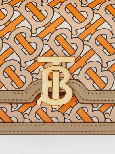Shop Burberry Belted Monogram Print Leather Tb Bag In Bright Orange