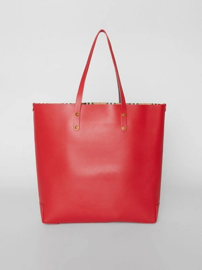 Shop Burberry Large Embossed Crest Leather Tote In Rust Red