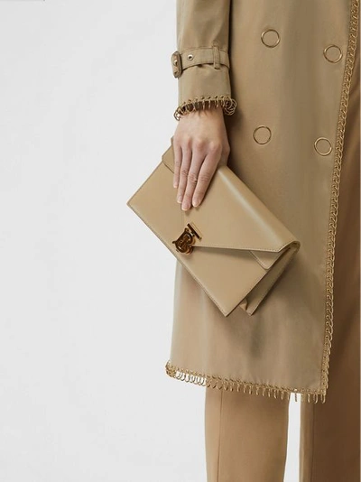Shop Burberry Small Leather Tb Envelope Clutch In Honey