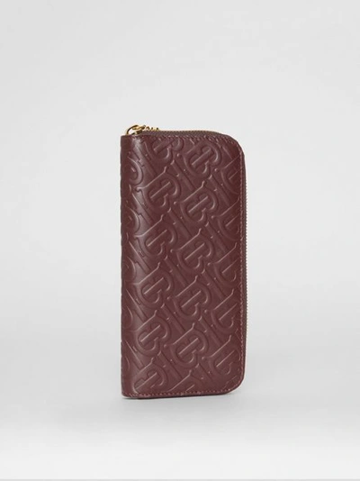 Shop Burberry Monogram Leather Ziparound Wallet In Oxblood